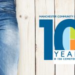 A pair of blue jeans on a white wooden backdrop next to the Manchester Community Library's tenth anniversary logo