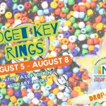 Colorful promotional image for a craft event at Manchester Community Library. The background is filled with brightly colored plastic pony beads. Large text reads: “Fidget Key Rings” and “August 5 – August 8.” Smaller text says, “In the YA Loft during library hours.” The image includes illustrations of crayons, scissors, and a paint palette, along with a key ring graphic. A yellow star logo at the bottom reads “Summer Reading Program 2025 – MCL – Color Our World.” A banner across the bottom says, “Drop-In Craft.”